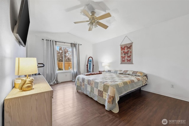 bedroom featuring ceiling fan, vaulted ceiling, baseboards, and wood finished floors