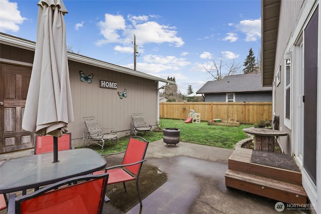 view of patio / terrace with outdoor dining space and fence