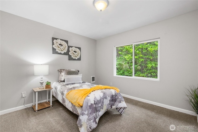 carpeted bedroom with baseboards and visible vents