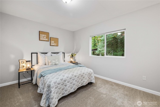 carpeted bedroom with baseboards