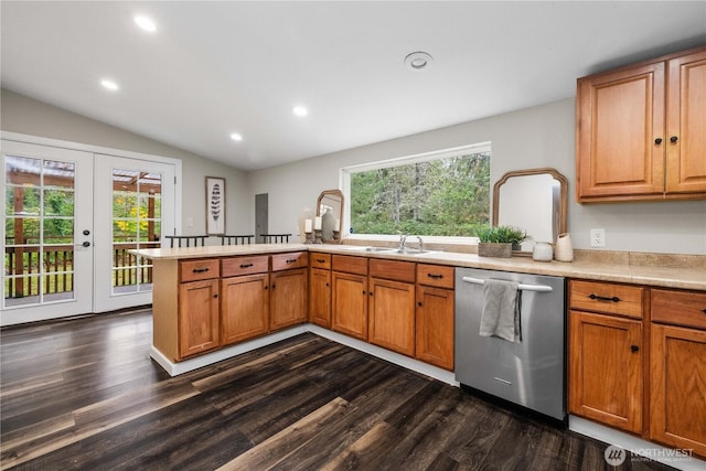 kitchen featuring a peninsula, a wealth of natural light, dishwasher, and french doors