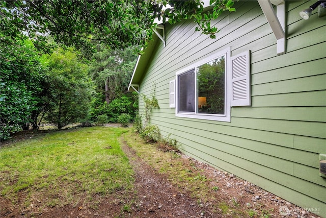 view of home's exterior featuring a yard