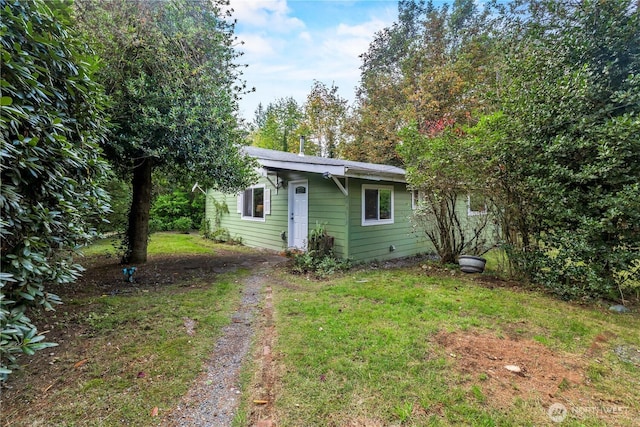 exterior space with a yard and driveway