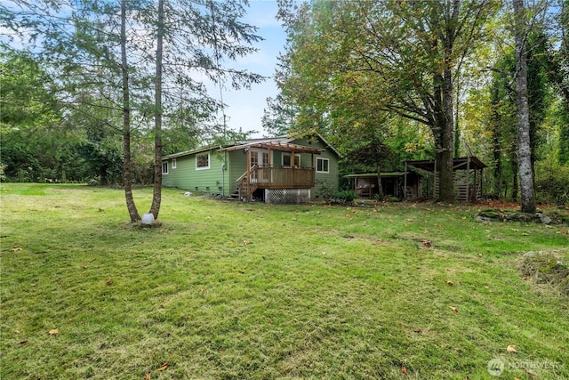 view of yard featuring a deck