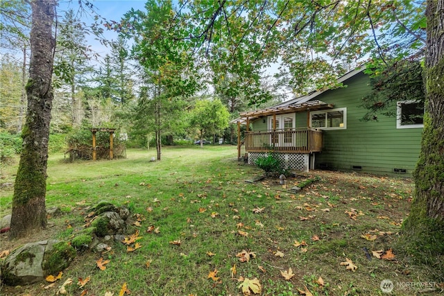 view of yard featuring a wooden deck