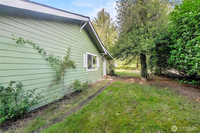 view of home's exterior featuring a yard