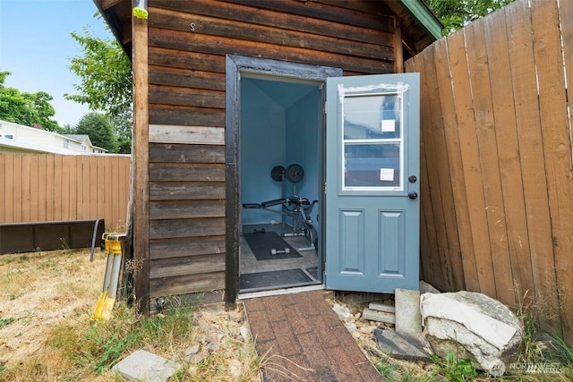 view of outdoor structure with fence