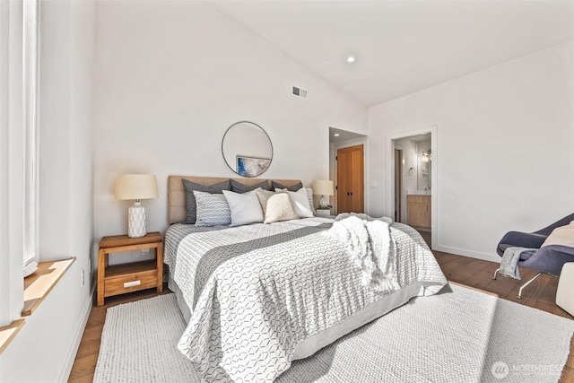 bedroom with recessed lighting, visible vents, vaulted ceiling, wood finished floors, and baseboards