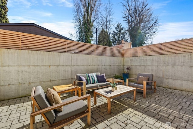 view of patio with a fenced backyard and an outdoor hangout area