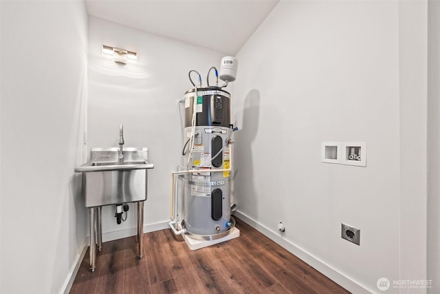 utility room featuring heat pump water heater