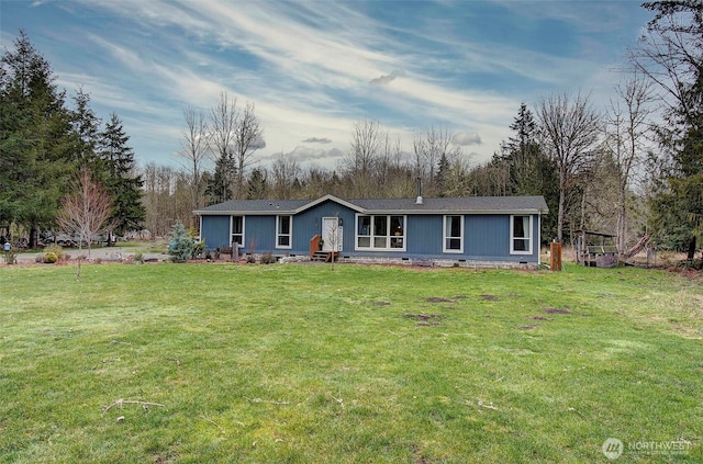 view of front of property with a front yard and crawl space