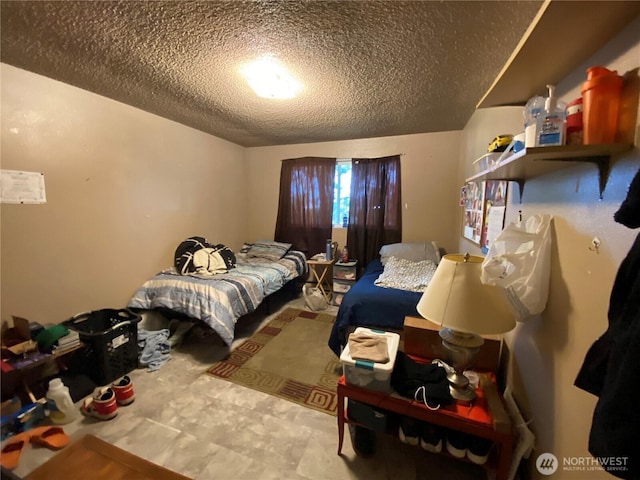 bedroom featuring a textured ceiling