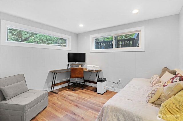 bedroom with light wood-type flooring, baseboards, and recessed lighting