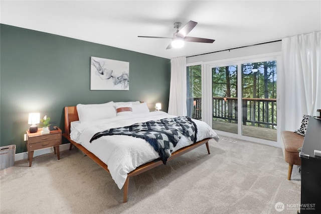 carpeted bedroom featuring access to outside, visible vents, and ceiling fan