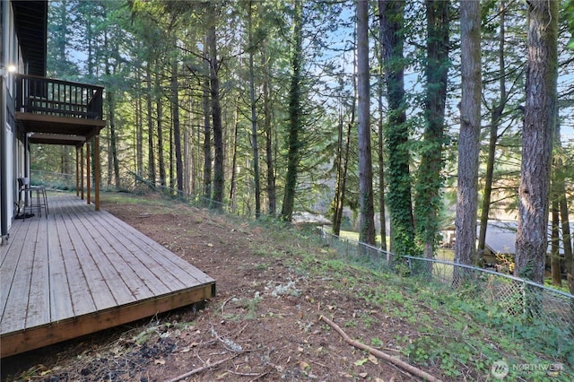 wooden terrace featuring fence