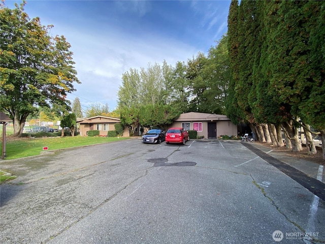 view of front of home featuring uncovered parking