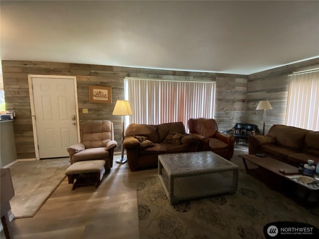 living room with wood walls