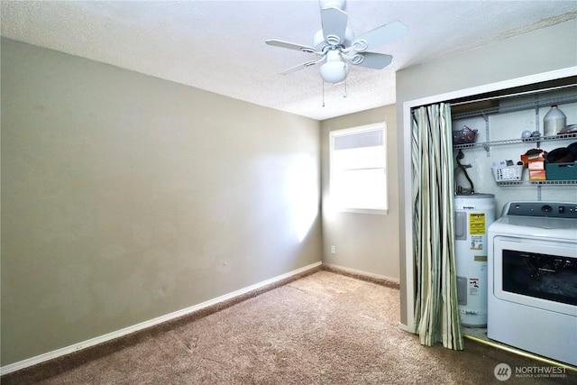 interior space with carpet floors, washer / clothes dryer, water heater, a textured ceiling, and baseboards