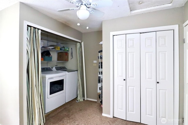 clothes washing area with ceiling fan, laundry area, washer and clothes dryer, and carpet