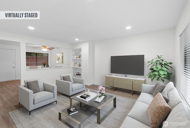 living area with ceiling fan, wood finished floors, and recessed lighting