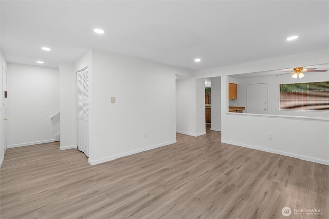 unfurnished living room with baseboards, ceiling fan, light wood-style flooring, and recessed lighting