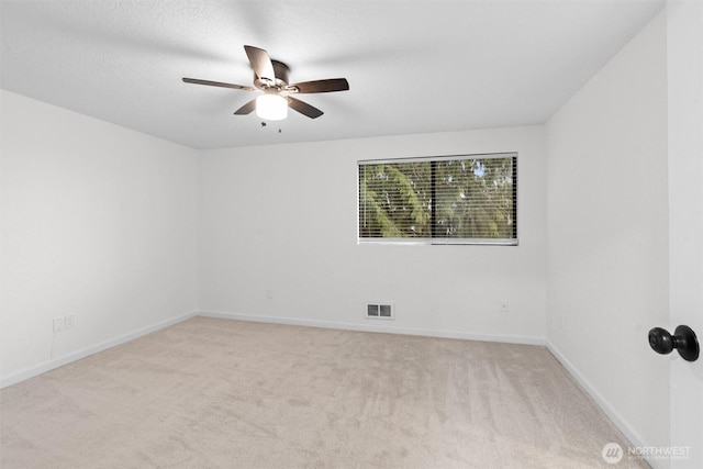 spare room with baseboards, visible vents, ceiling fan, a textured ceiling, and carpet flooring