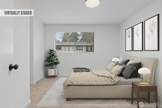 carpeted bedroom featuring baseboards