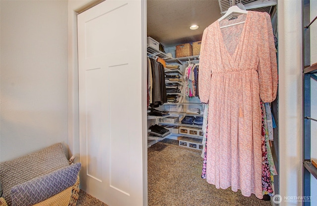 spacious closet with carpet flooring