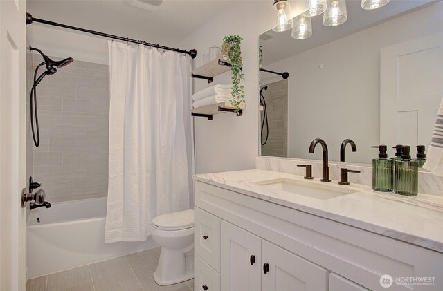 full bathroom with vanity, tile patterned floors, toilet, and shower / bath combo with shower curtain