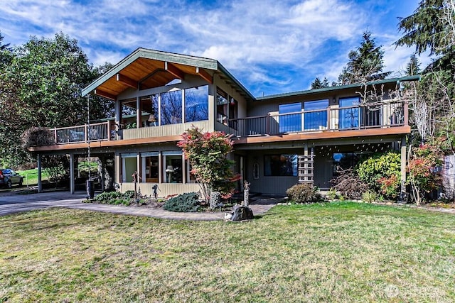 view of front of house with stairway, a deck, and a front yard