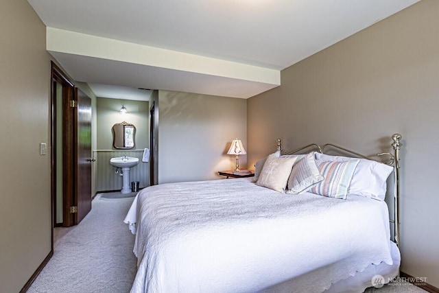 carpeted bedroom with baseboards