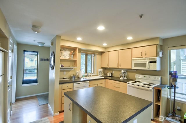 kitchen with open shelves, dark countertops, recessed lighting, a sink, and white appliances