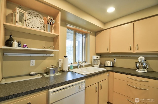 kitchen with dark countertops, open shelves, white dishwasher, and a sink