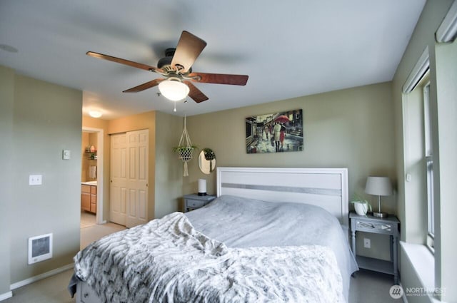 bedroom featuring a closet, baseboards, and a ceiling fan