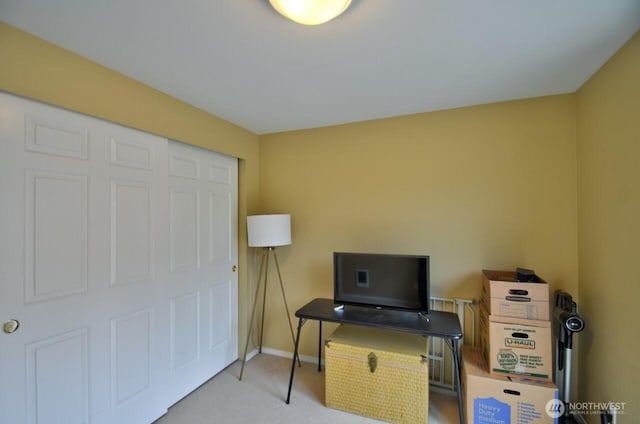 office area with carpet flooring and baseboards