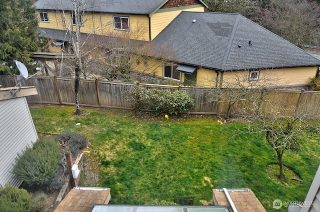 view of yard with a fenced backyard