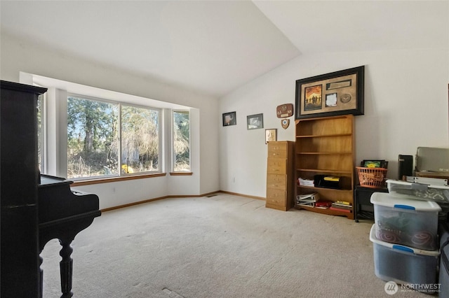 sitting room featuring baseboards, carpet flooring, and vaulted ceiling