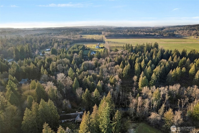 aerial view featuring a view of trees