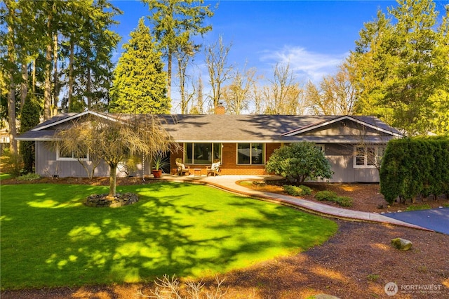 single story home with a front lawn and a chimney