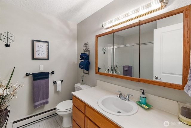 full bathroom featuring vanity, a shower stall, a textured ceiling, toilet, and baseboard heating