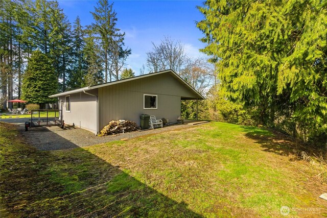 rear view of property with a lawn