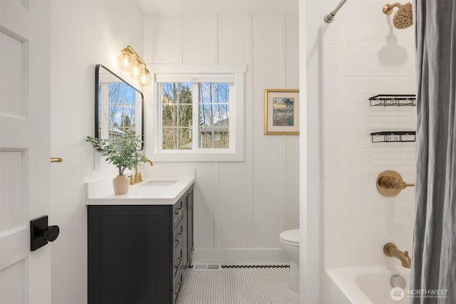 bathroom with vanity, visible vents,  shower combination, tile patterned floors, and toilet