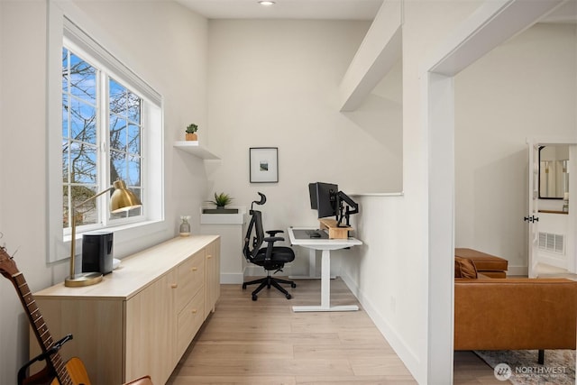 office featuring recessed lighting, light wood-style floors, visible vents, and baseboards