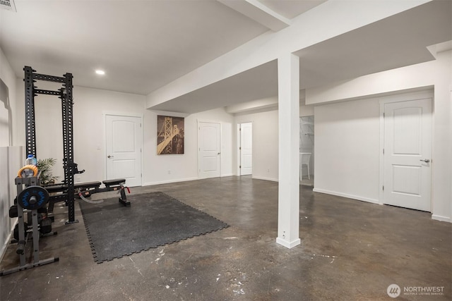 exercise room featuring recessed lighting and baseboards