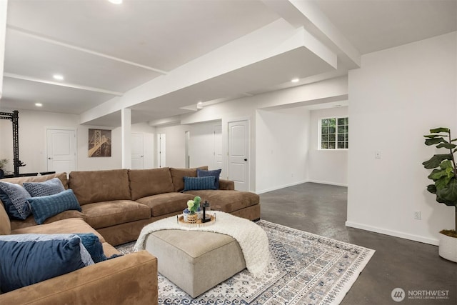 living area with recessed lighting, baseboards, and finished concrete floors