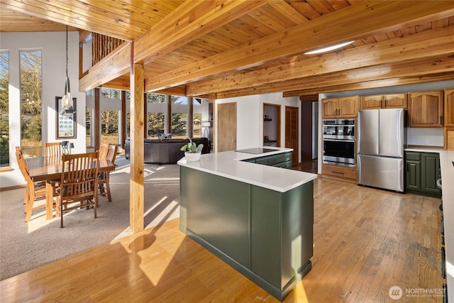 kitchen featuring stainless steel appliances, wooden ceiling, and beam ceiling