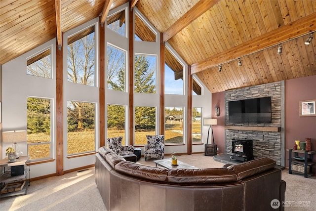 carpeted living room featuring beamed ceiling, wooden ceiling, and baseboards