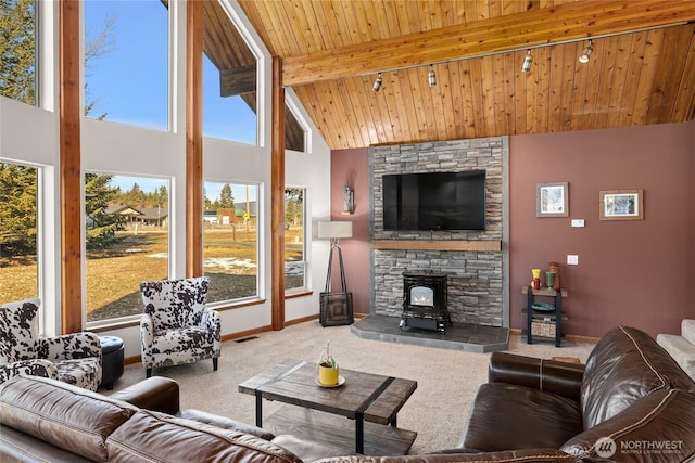 carpeted living room featuring visible vents, baseboards, wooden ceiling, beamed ceiling, and high vaulted ceiling