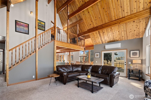 living room with an AC wall unit, stairway, carpet floors, and beamed ceiling