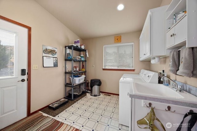 laundry area featuring cabinet space, baseboards, independent washer and dryer, a sink, and recessed lighting